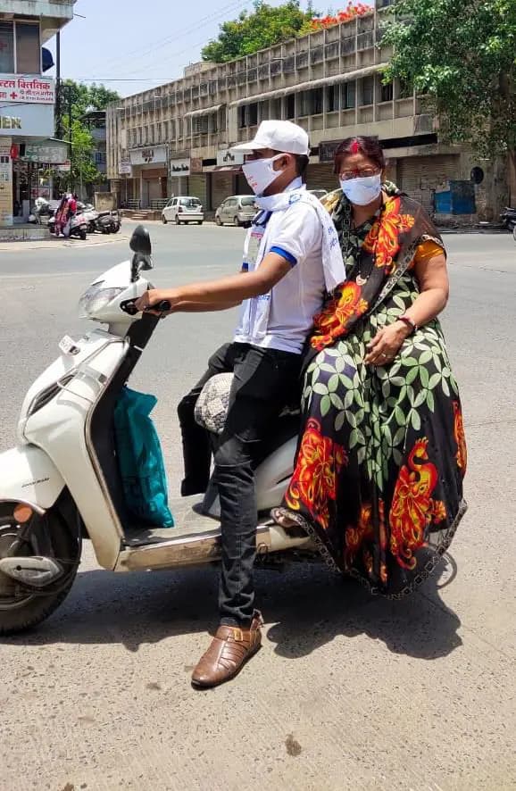Abhishek on a two-wheeler taking a patient to hospital during the lockdown