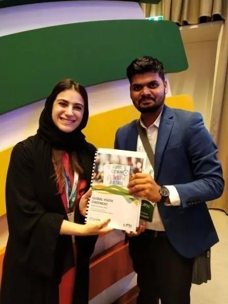 With Hana Al Hashimi, the UAE's chief negotiator for COP28, holding the Global Youth Statement.