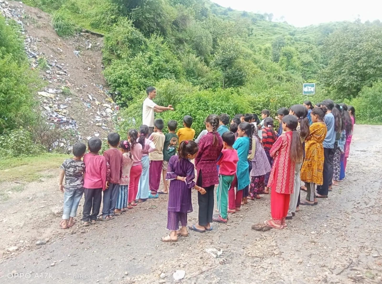 Community awareness drive on waste management at the village trenching ground.