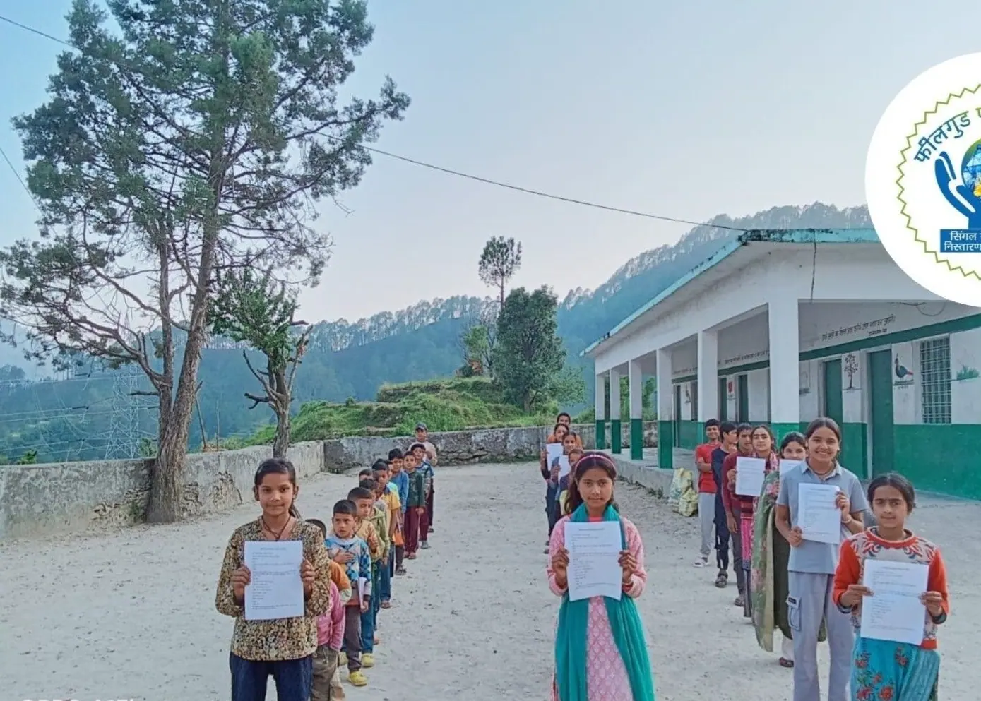 Children with their pledge sheets after the assembly.